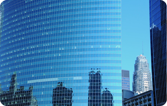 Glass skyrise with city reflection